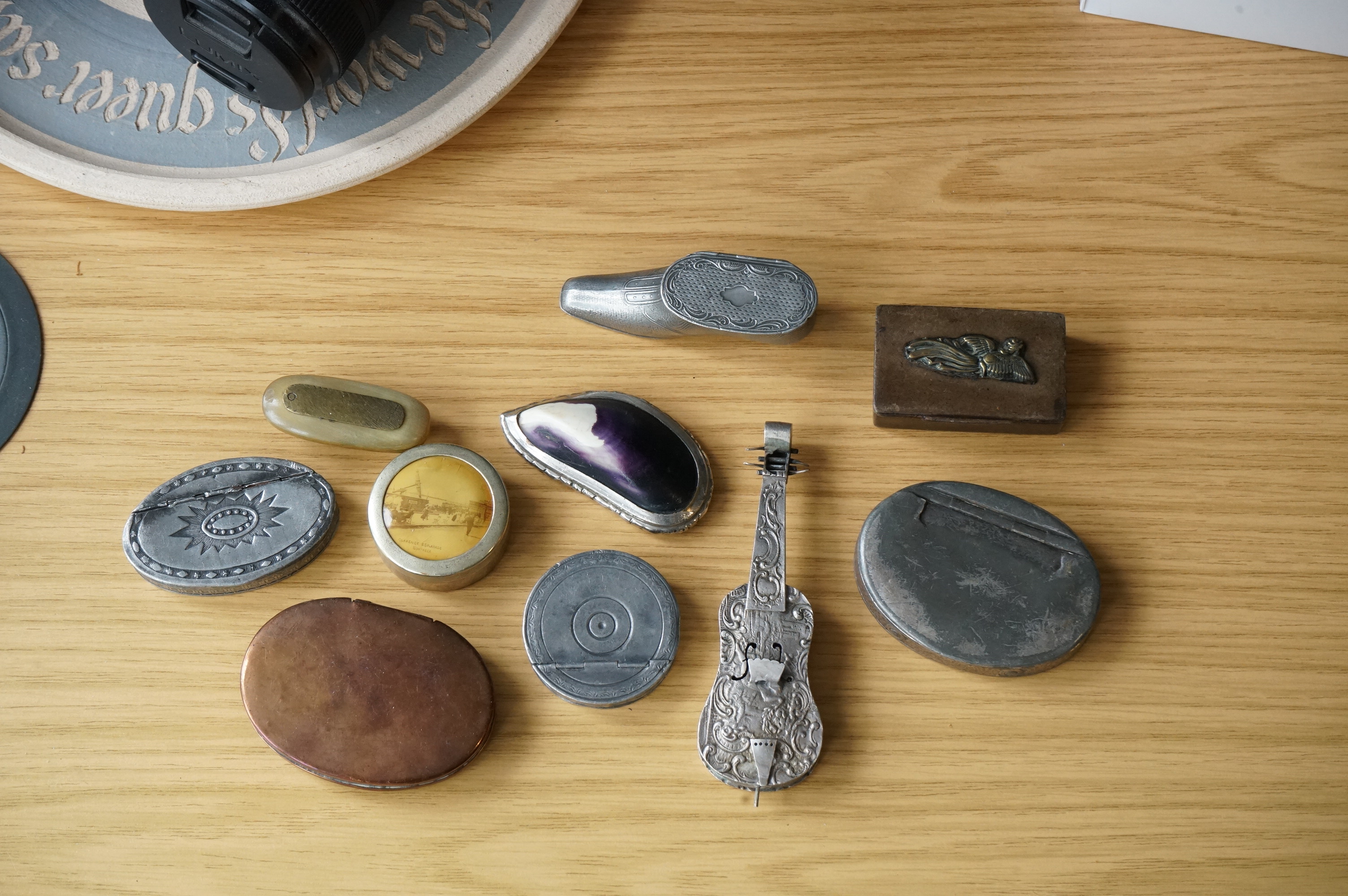 A collection of mixed metal stuff boxes including a novelty cello shaped box being 12cm long